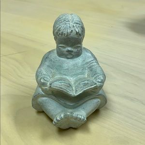 Isabel Bloom reading Child Statue